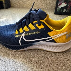 Nike kids or women’s Michigan
 Navy and Yellow Running Shoes